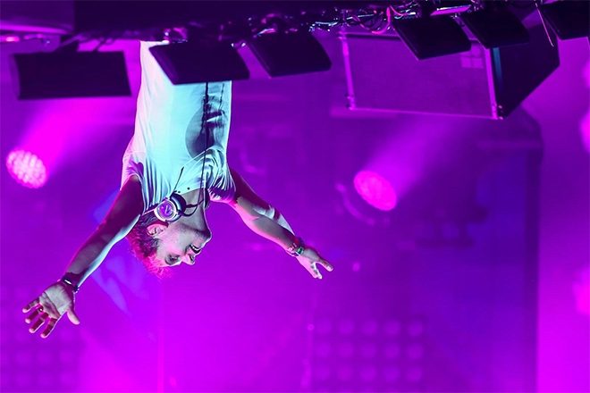 Armin Van Buuren plays upside down in custom-built DJ booth
