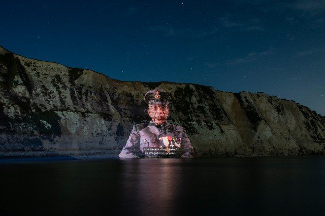 Led By Donkeys project #Justice4Windrush message onto White Cliffs of Dover